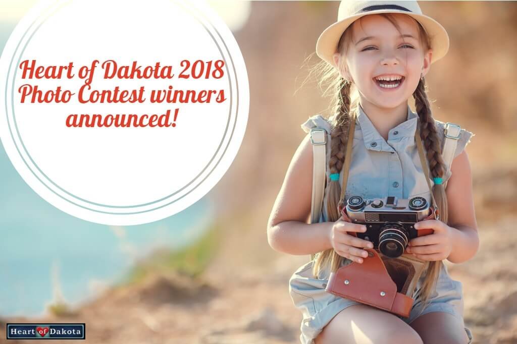 Heart of Dakota 2018 Photo Contest winners announced! - Photo of a smiling little girl at the seaside holding a vintage camera