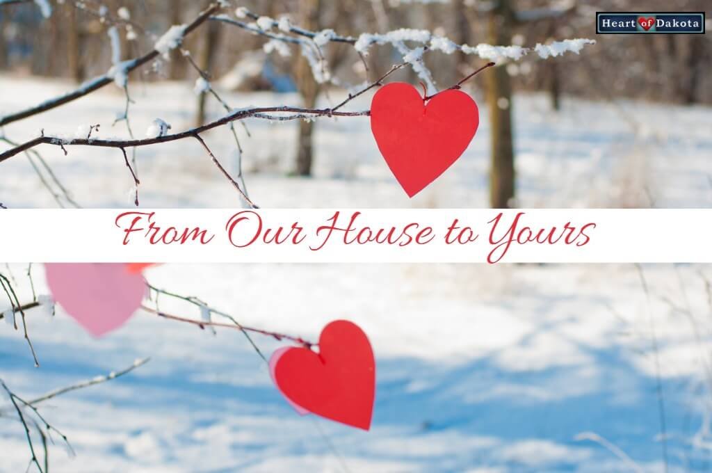 Heart of Dakota From Our House to Yours - picture of a snowy forest landscape with red wooden hearts hung on the bare, snow-covered branches of the trees