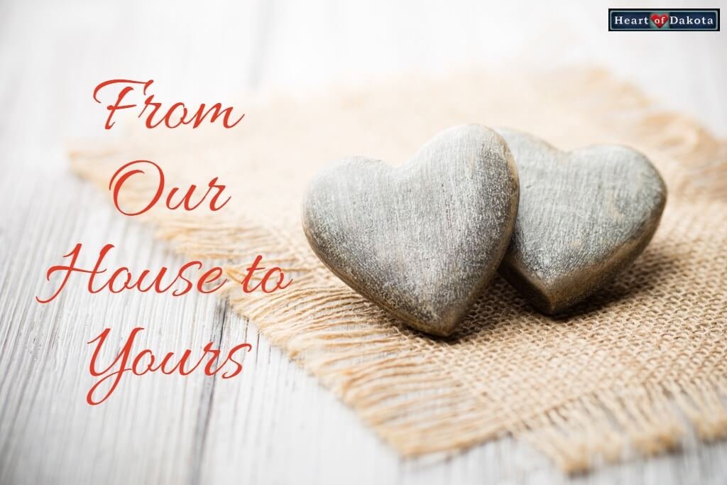 Heart of Dakota From Our House to Yours - photo of two stone hearts nestled together, sitting on a tiny cloth mat.